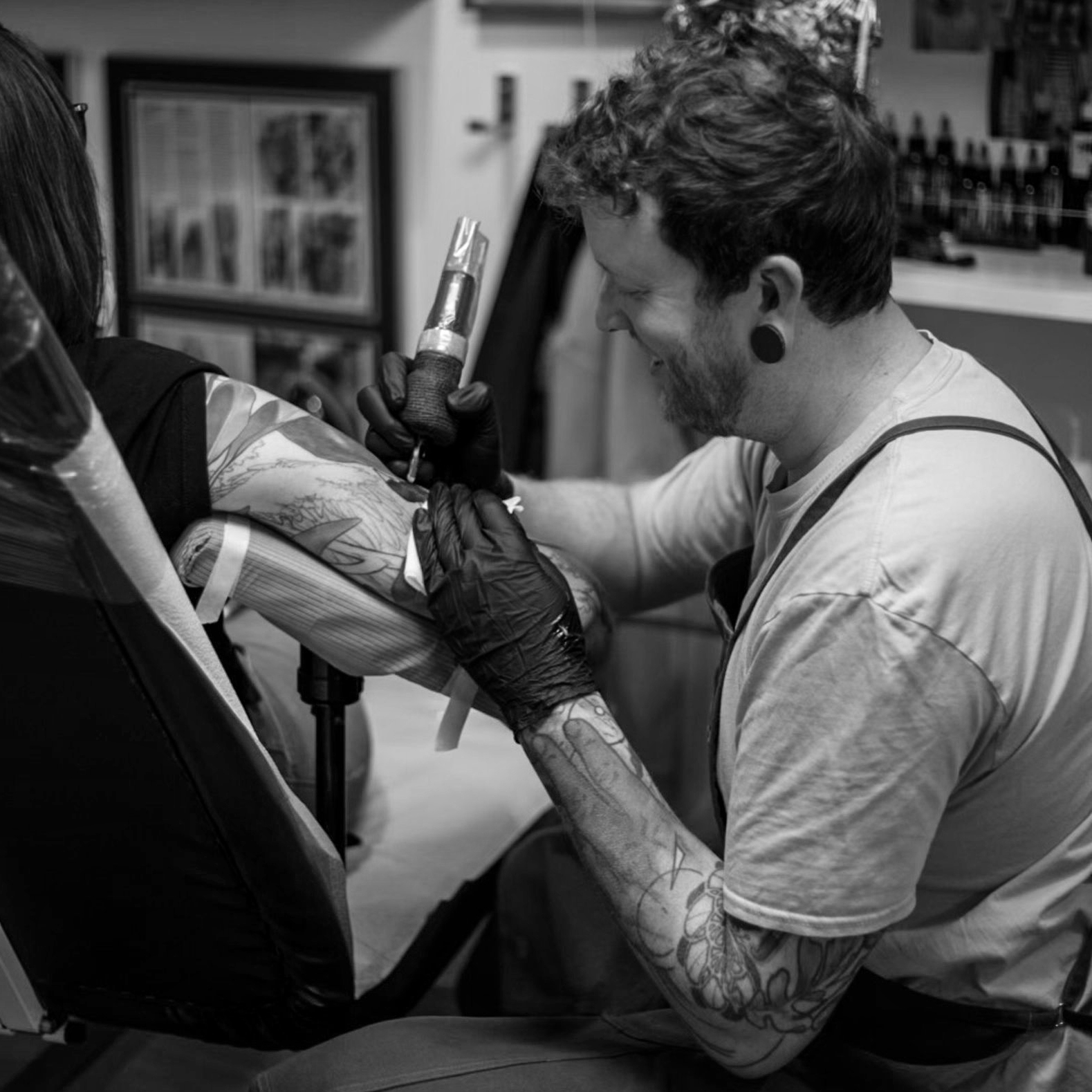 Cody tattooing a client at Epoch Tattoo